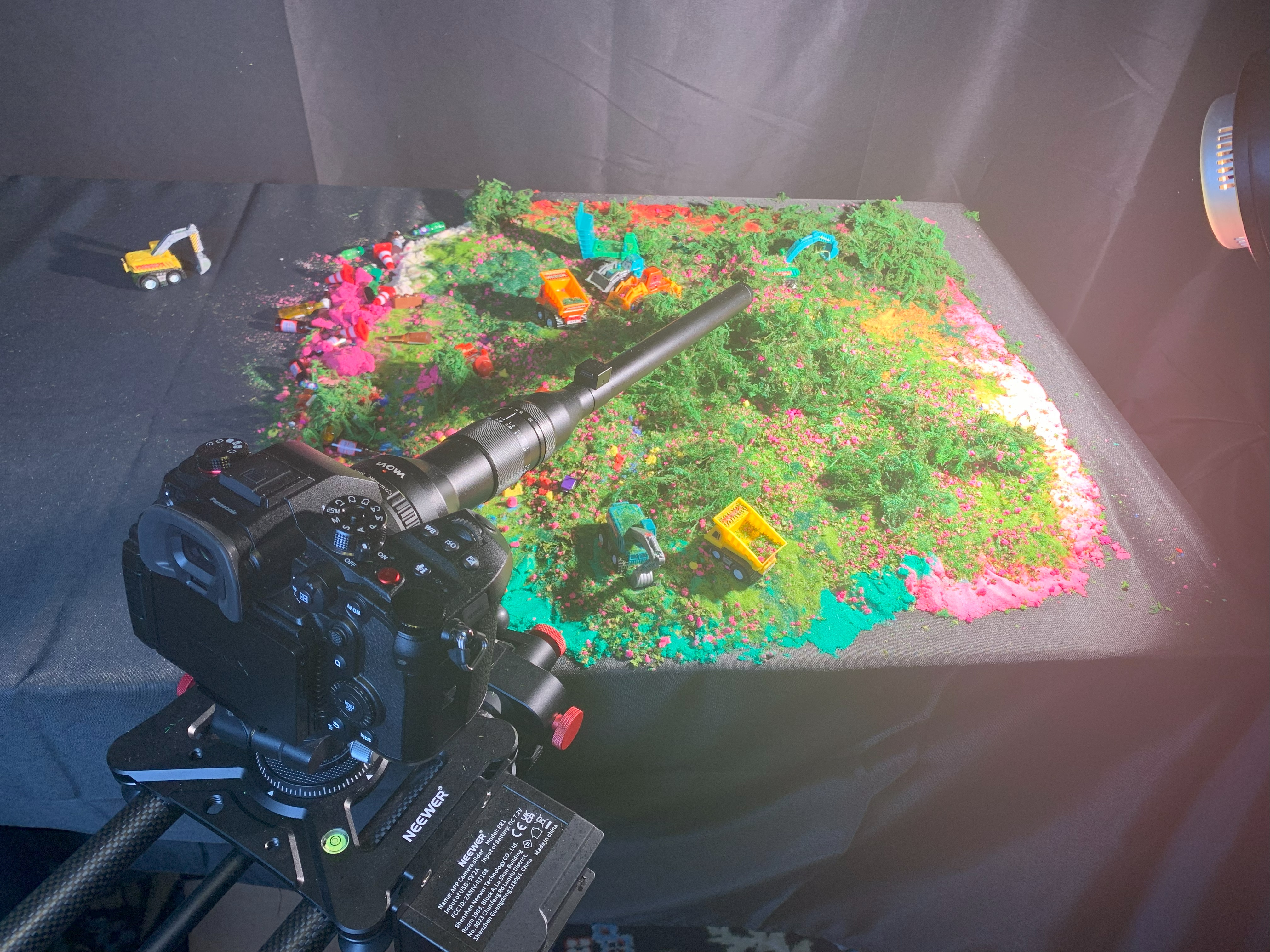 Macro camera rig framed over a colorful miniature set