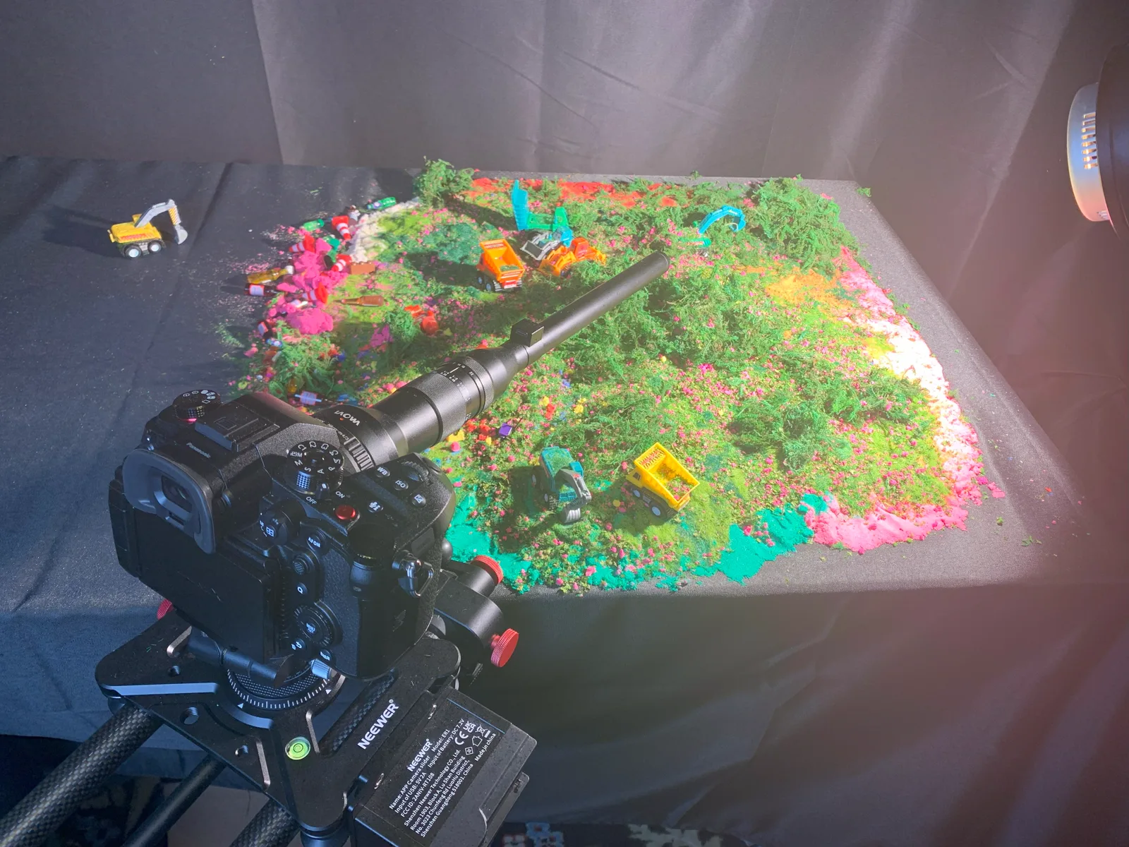 Macro camera rig framed over a colorful miniature set