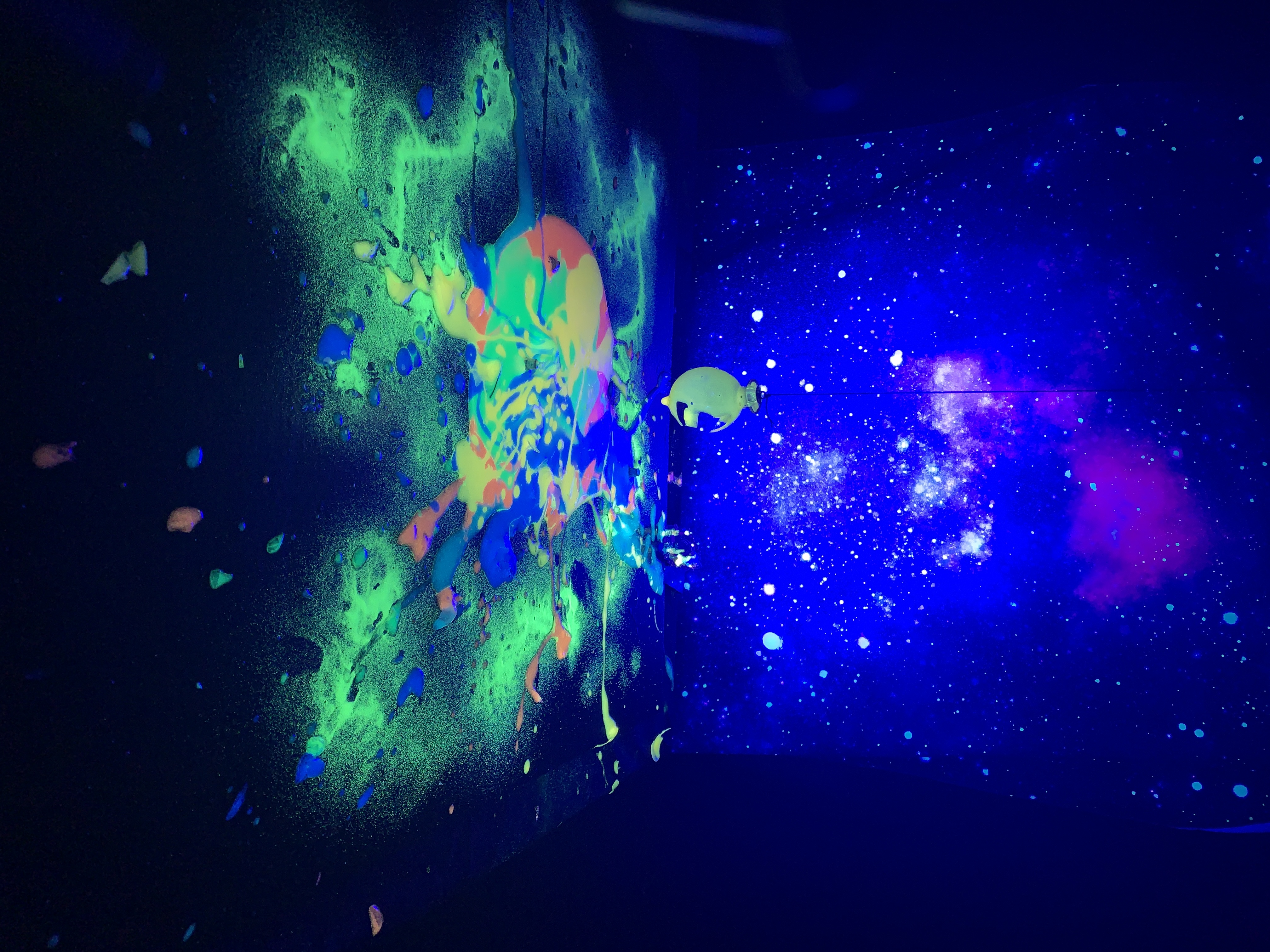 Neon paint glowing under ultraviolet light