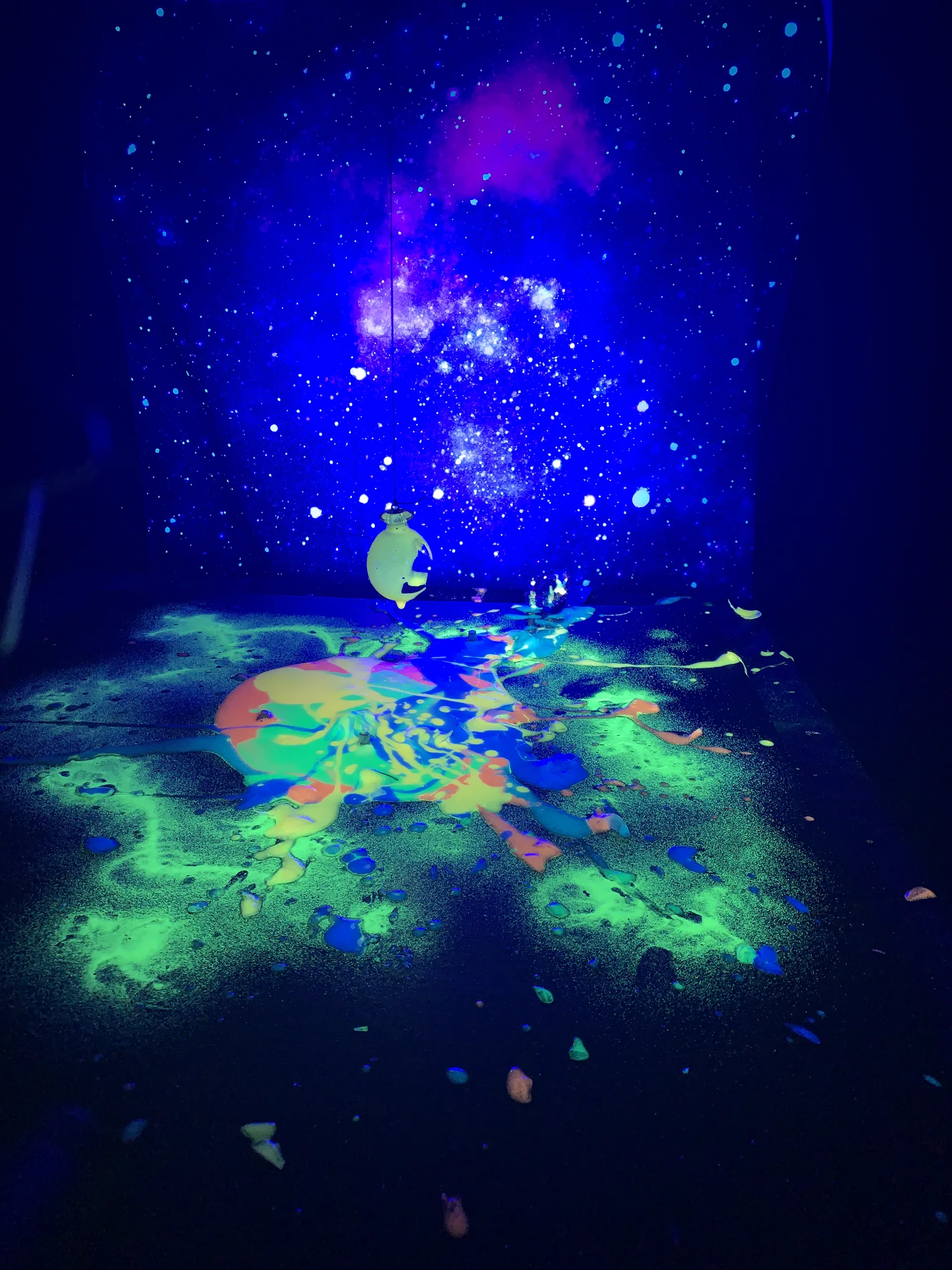 Neon paint glowing under ultraviolet light